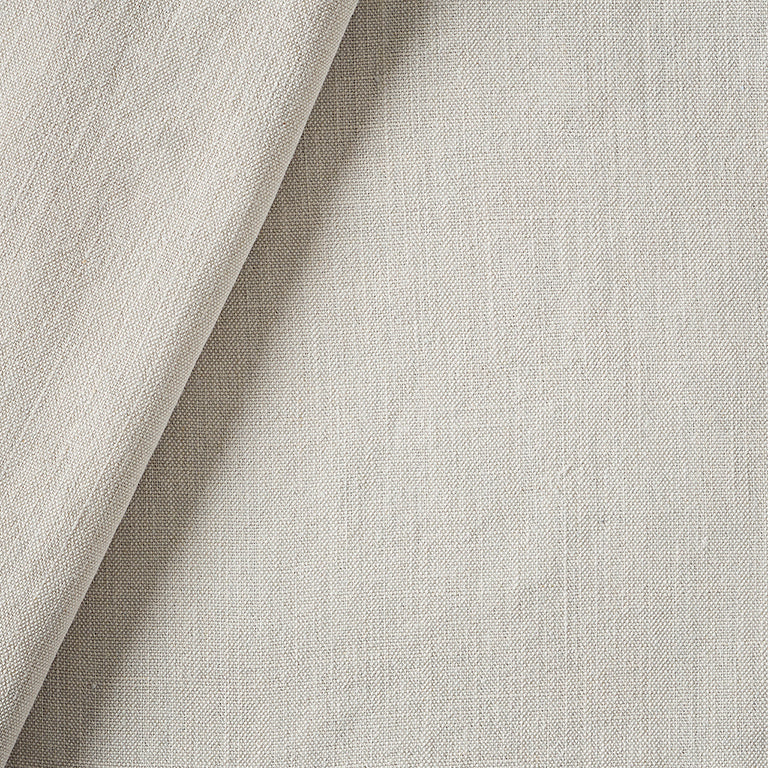 Close-up of textured beige fabric with a slight sheen