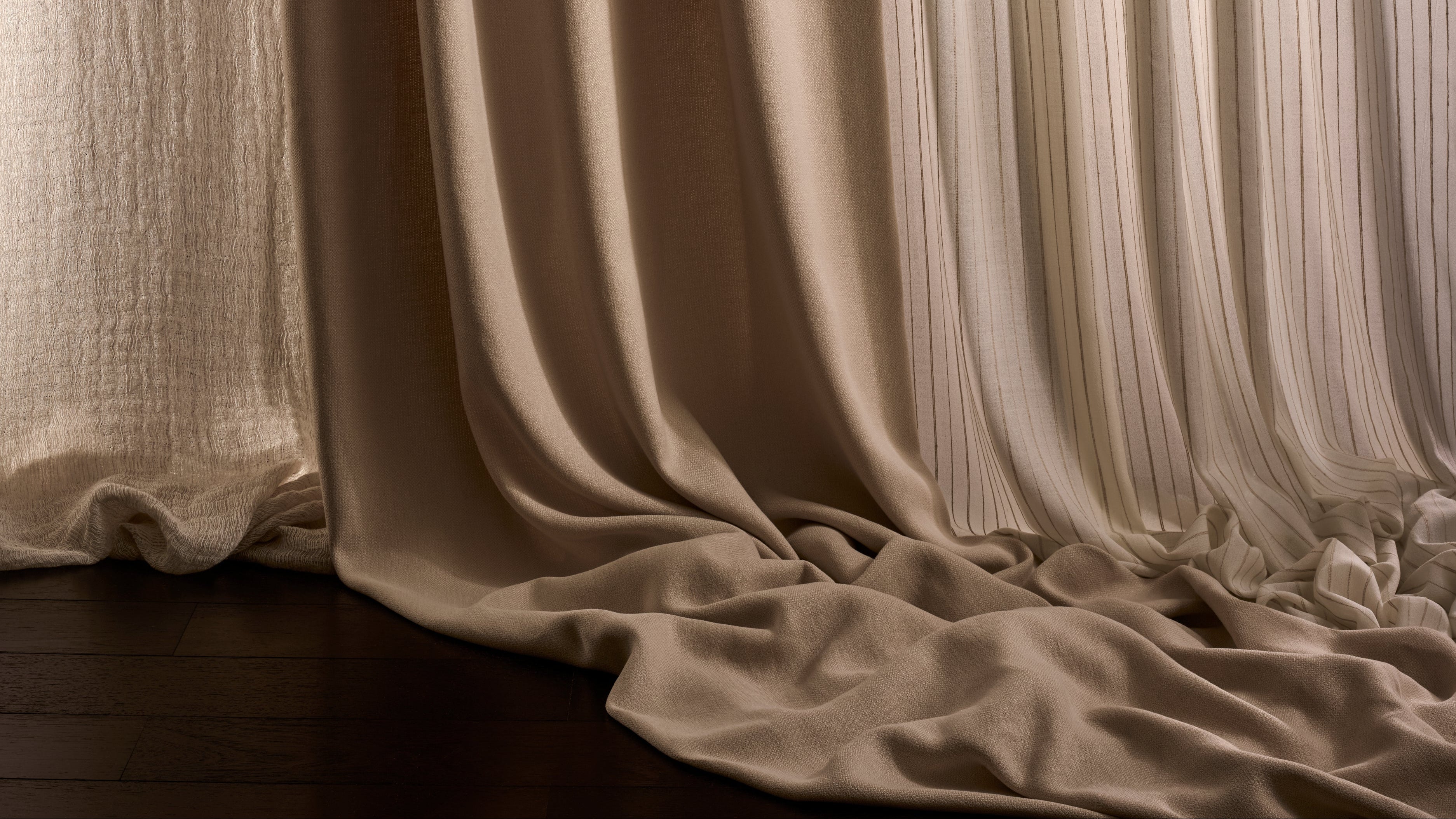 Draped beige curtain on a dark background